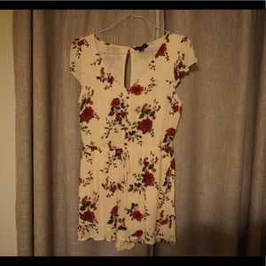Short sleeve cream romper worn maybe once if at all